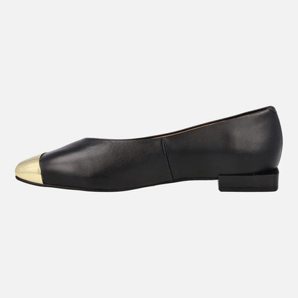 Black leather flats with golden metallic toe