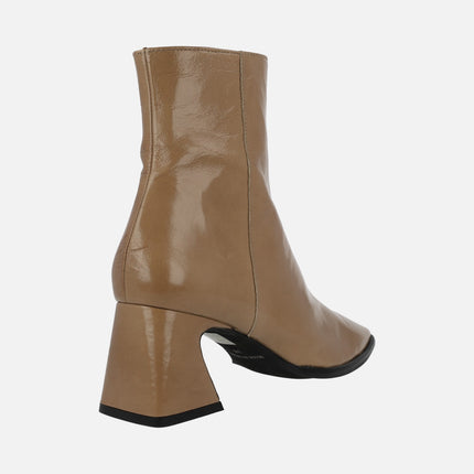 Leather ankle boots with brightness and half height heel