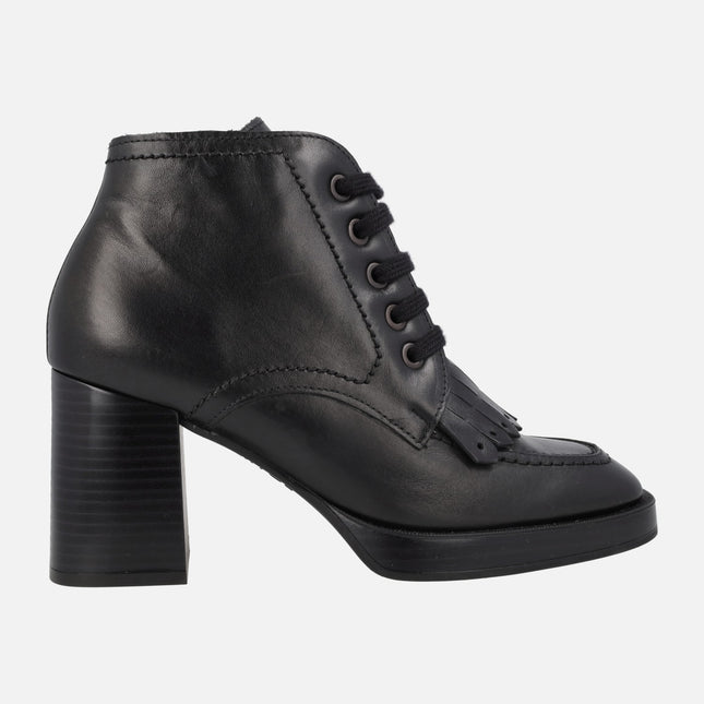 Black leather boots with laces and fringes
