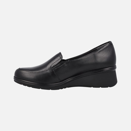 Black leather moccasins with elastics and low wedge
