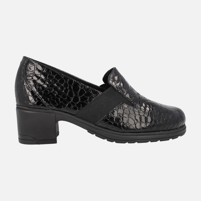 Heeled loafers in patent leather with snake print