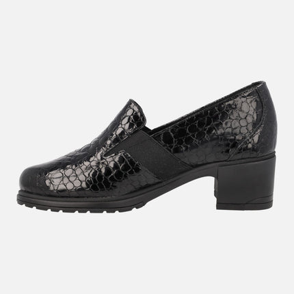 Heeled loafers in patent leather with snake print