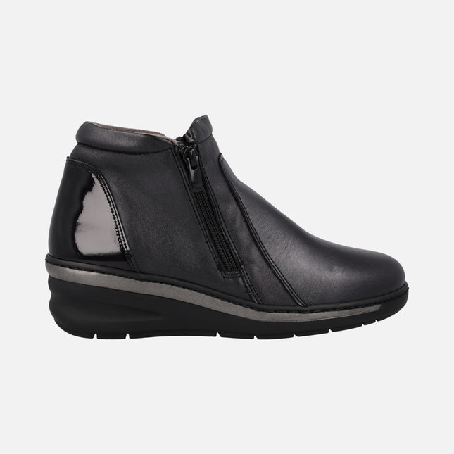 Black leather ankle boots with patent leather back and zippers