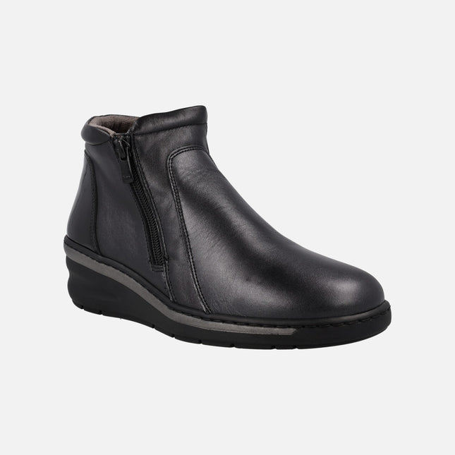 Black leather ankle boots with patent leather back and zippers