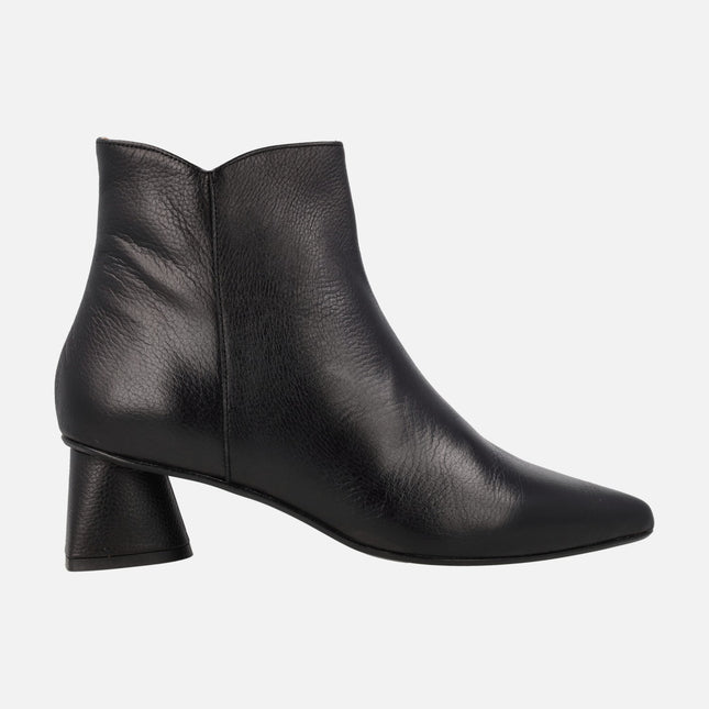 Black leather ankle boots with sharp toe and geometric heels