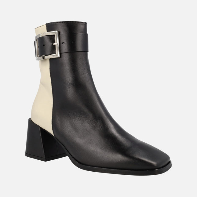 Bicolor leather ankle boots in Black and Beige with buckle ornament