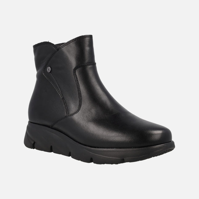 Black leather boots with light rubber floor