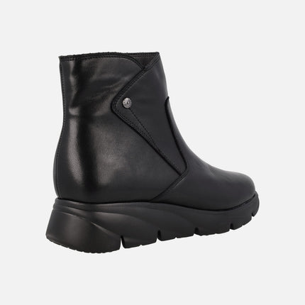 Black leather boots with light rubber floor