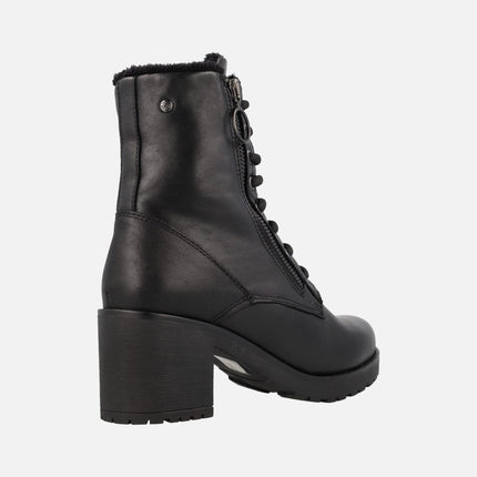 Black leather heeled boots with zip