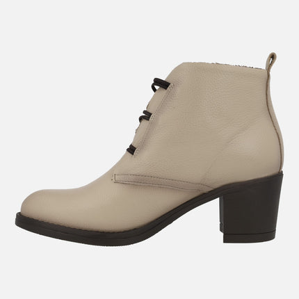 Leather ankle boots with wide heel and button closure