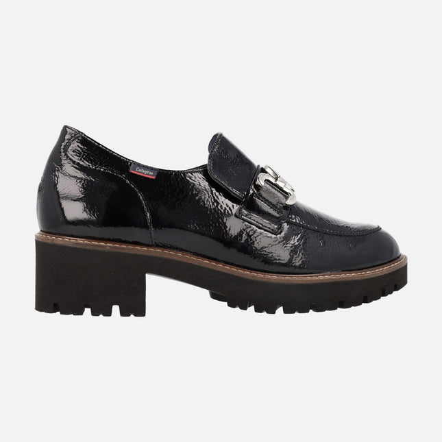 Black patent leather moccasins with ornament and track outsole