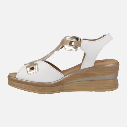 Wedged sandals in white leather with golden details
