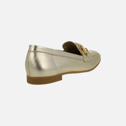 Flat moccasins in gold metallic leather with metallic ornament