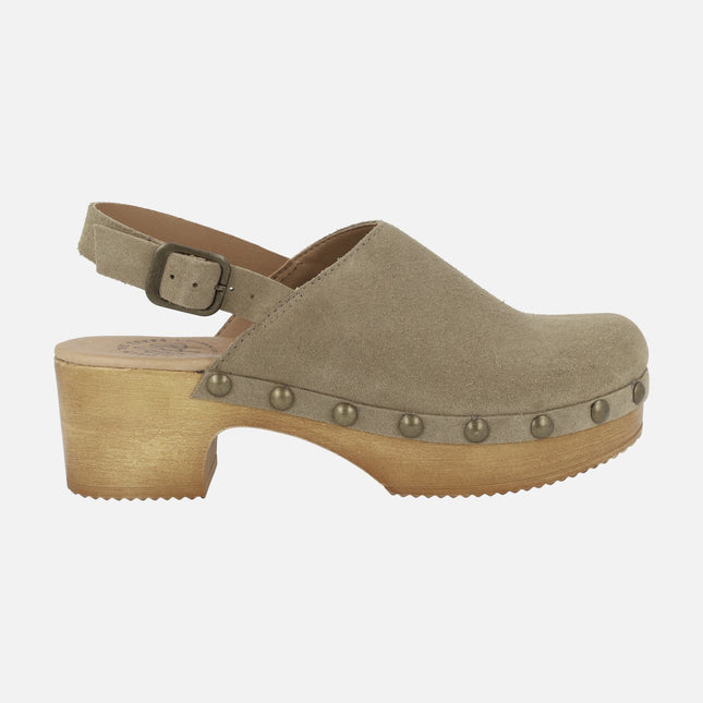 Suede clogs with buckled strip and studs