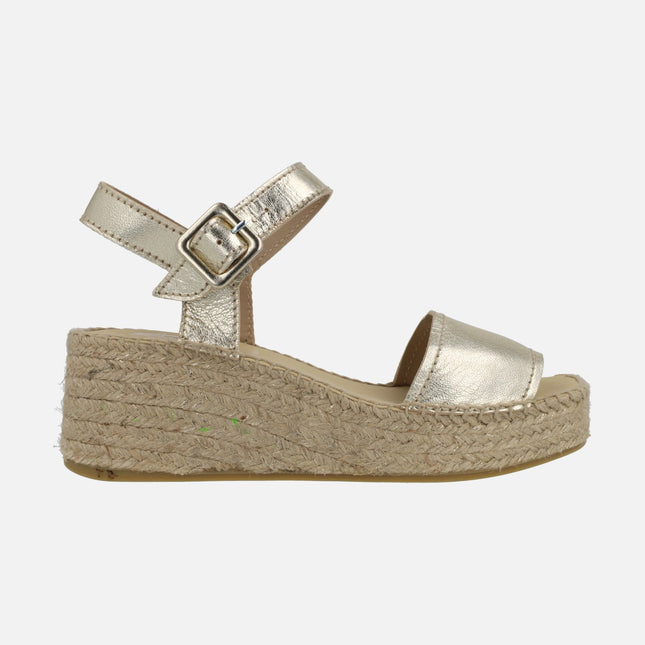 Leather espadrilles with buckle closure and natural fiber wedge