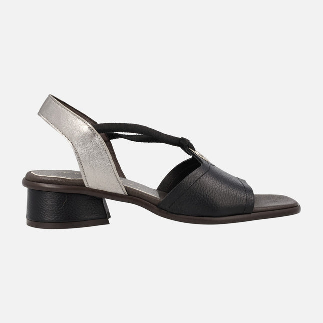 Black leather sandals with silver heel and elastics