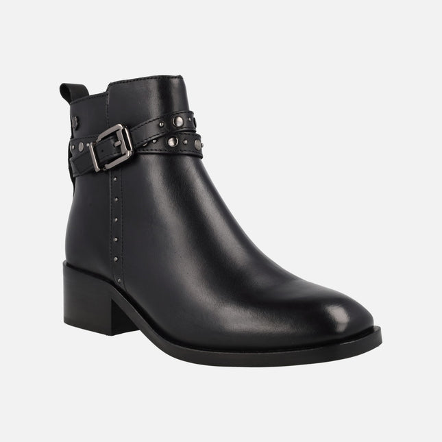 Black leather ankle boots with studs and double strip with buckle