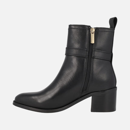 Black leather ankle boots with buckle and middle heel 