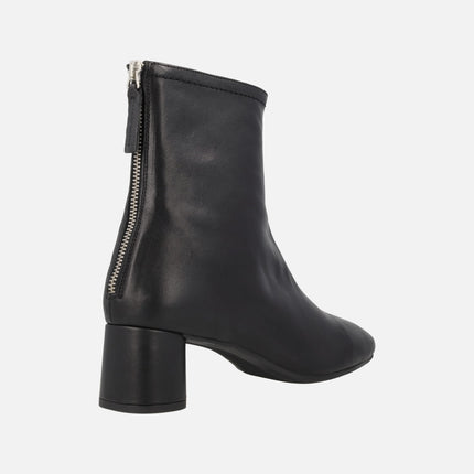 Doha Medium heeled booties on black leather