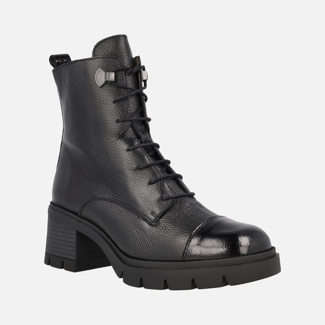 Black leather heeled ankle boots with patent leather toe