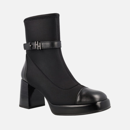 Heel and platform ankle boots in elastic fabric