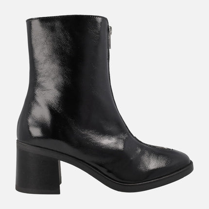 Heeled boots in black patent leather with front zipper