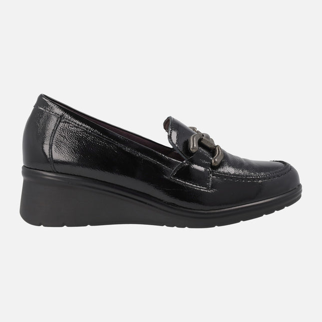 Black patent leather moccasins with metal ornament and middle wedge