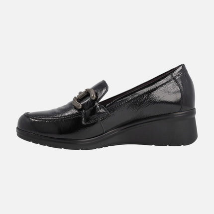 Black patent leather moccasins with metal ornament and middle wedge