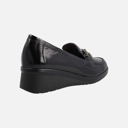 Black patent leather moccasins with metal ornament and middle wedge