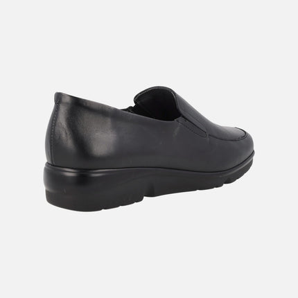 Black leather moccasins with lateral elastics