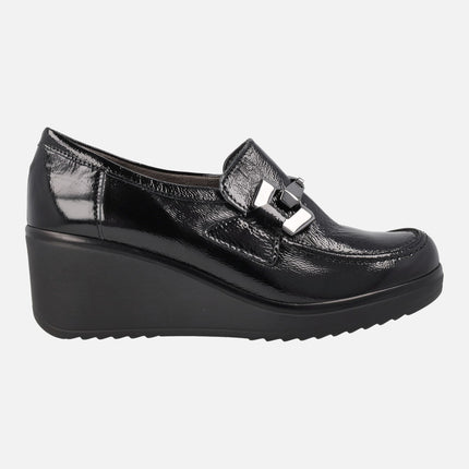 Black patent leather moccasins with high wedge and metallic ornament