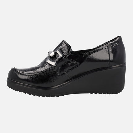 Black patent leather moccasins with high wedge and metallic ornament