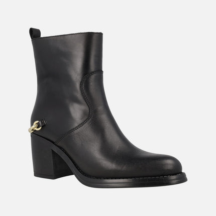 Leyna black leather heeled boots with golden ornament in the heel