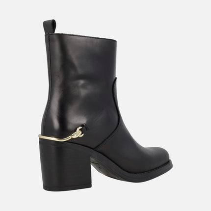 Leyna black leather heeled boots with golden ornament in the heel