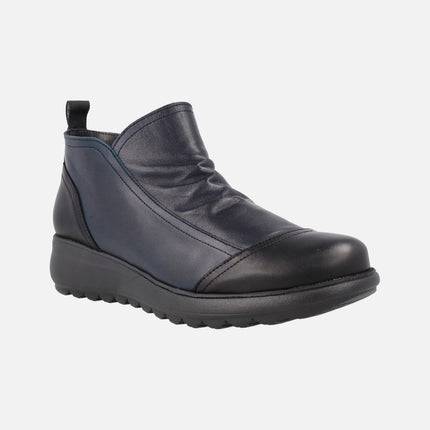 Low ankle boots in blue leather combined with Black