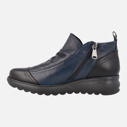 Low ankle boots in blue leather combined with Black