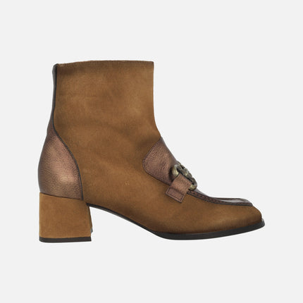 Heeled booties in brown combination with metallic ornament