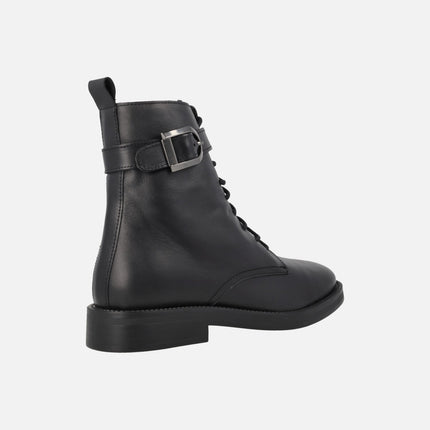 Black leather boots with laces and buckle