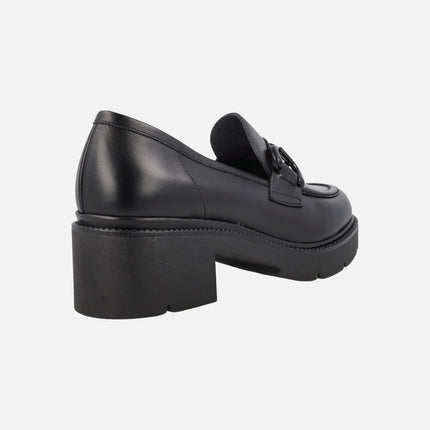 Black leather moccasins with detail in the upper and track outsole