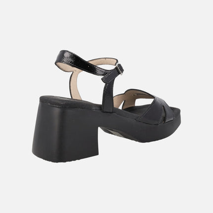 Hura heeled sandals in black patent leather