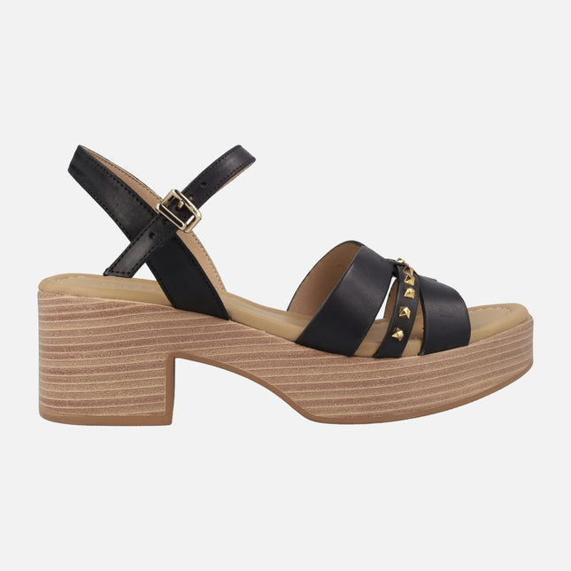 Heeled sandals with platform and studs detail