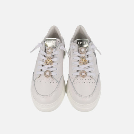 White leather sneakers with golden ornaments