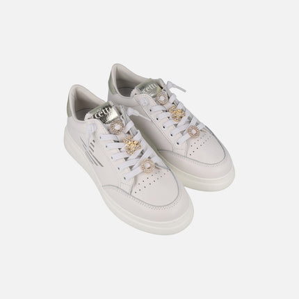 White leather sneakers with golden ornaments