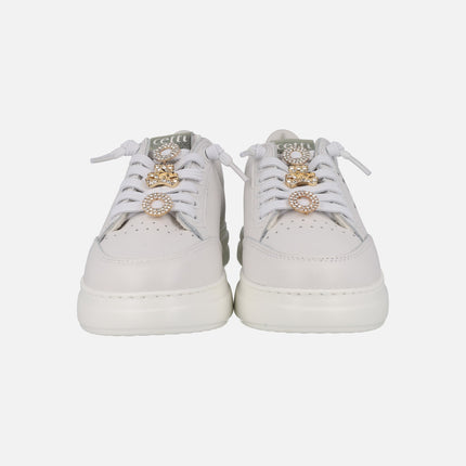 White leather sneakers with golden ornaments