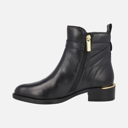 Black leather ankle boots with golden metal details