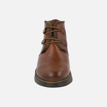 Botines de piel con forro de pelo y cierre de botones