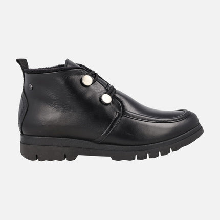 Botines bajos en piel negra con cierre de botones y forro de pelo