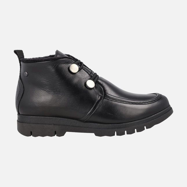Botines bajos en piel negra con cierre de botones y forro de pelo