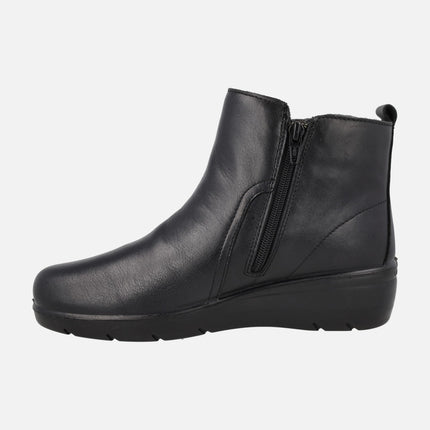 Botines negros de piel con cremallera y elástico bicolor