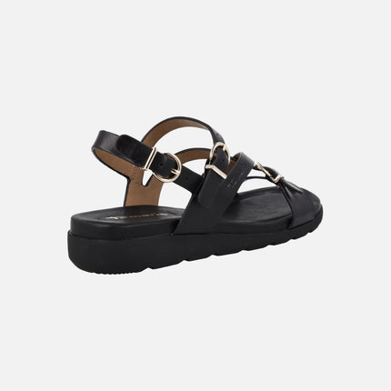 Sandalias negras de piel con hebillas doradas